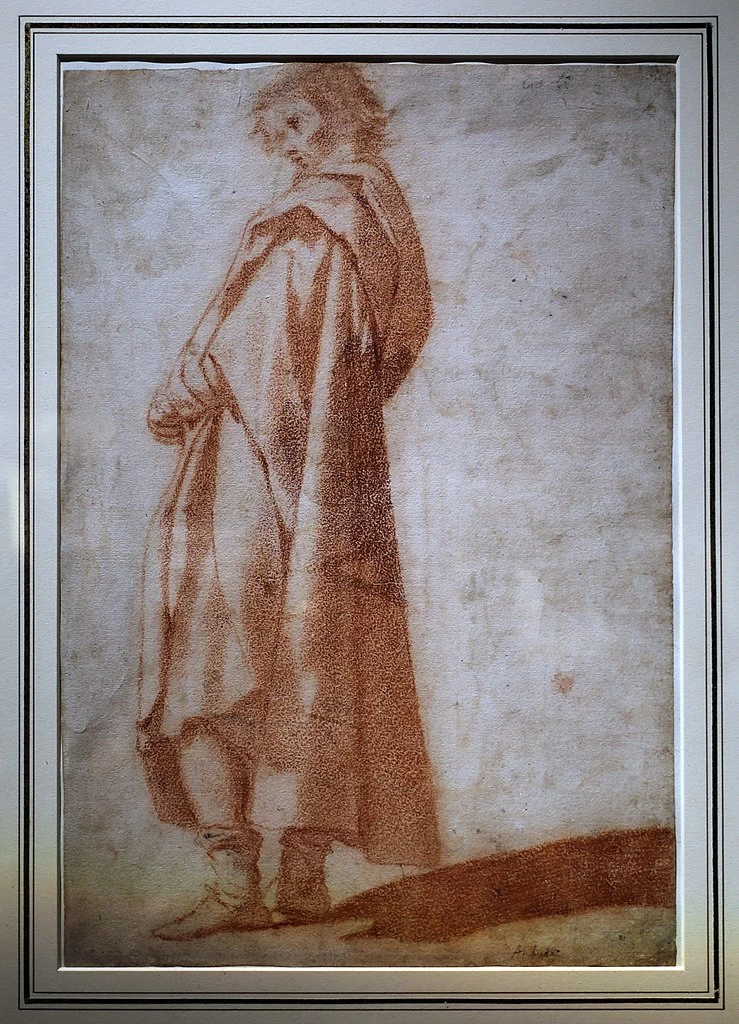 Figura maschile stante drappeggiata che guarda a sinistra